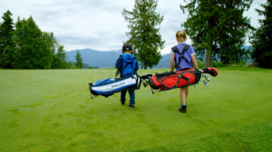 Two kids with golf bags at Balfour Golf Course