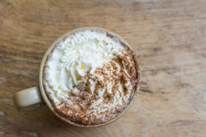 A hot chocolate with whipping cream.
